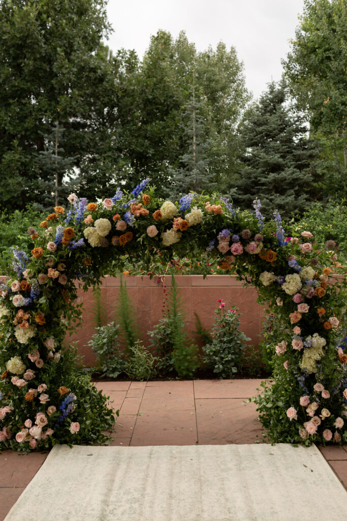 Custom floral arch for the Denver Botanic Garden Wedding.