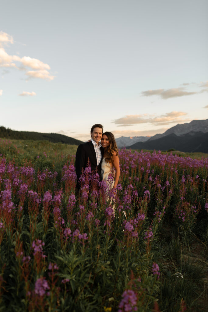 happy couple in the wildflowers after aspen wedding celebration
