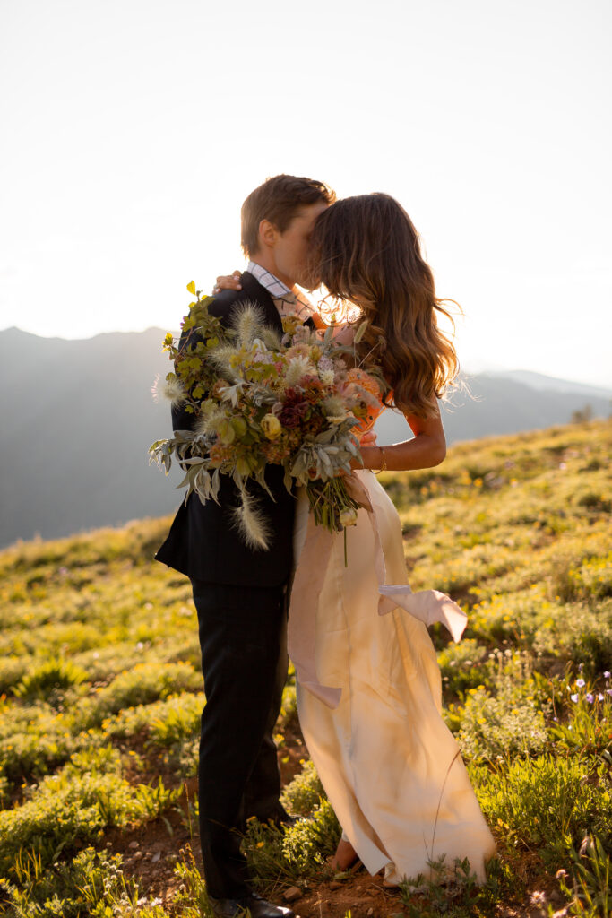 sunlight hitting bride and groom at elopement in aspen