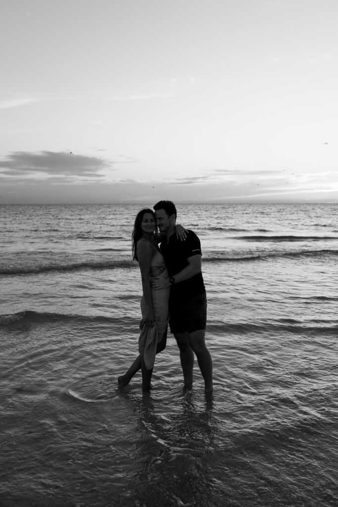 couple kissing in florida at the beach