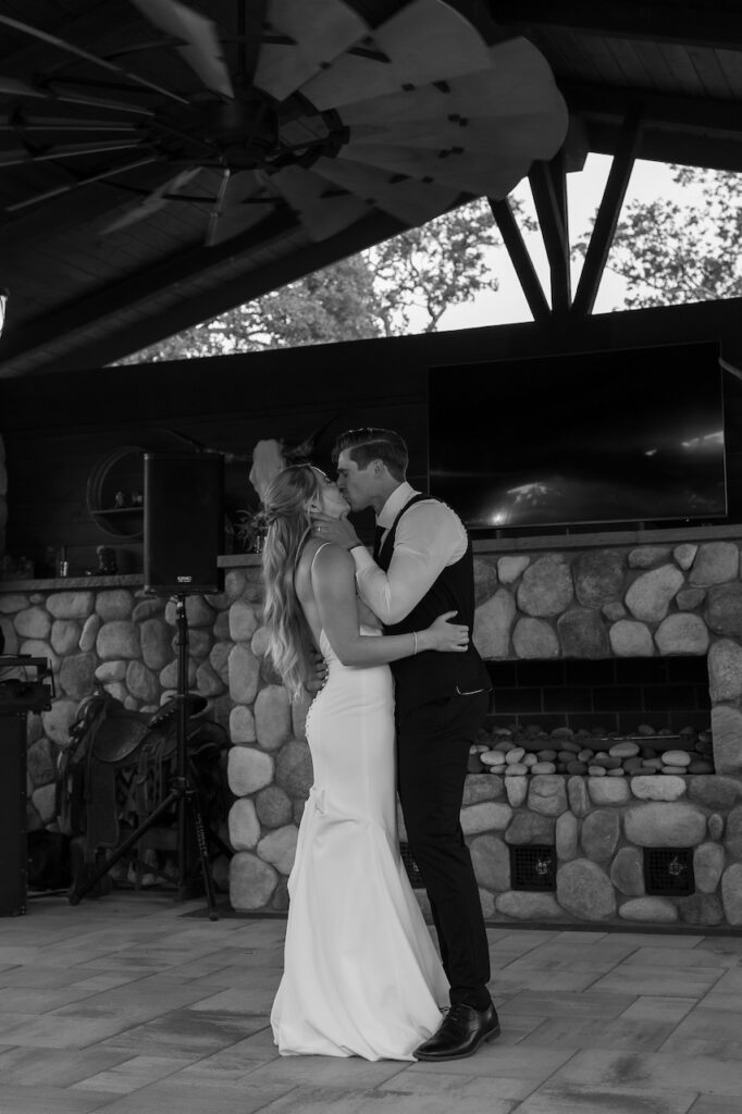 Couple’s first dance under twinkling lights at backyard wedding in California