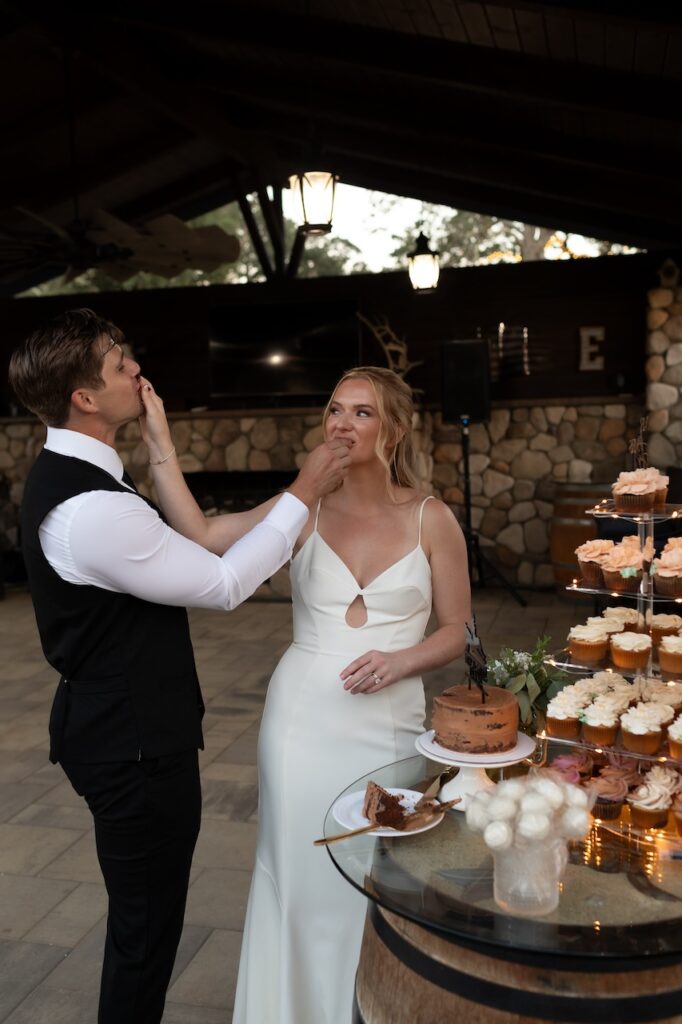 bride and groom feeding wedding cake at livermore california wedding