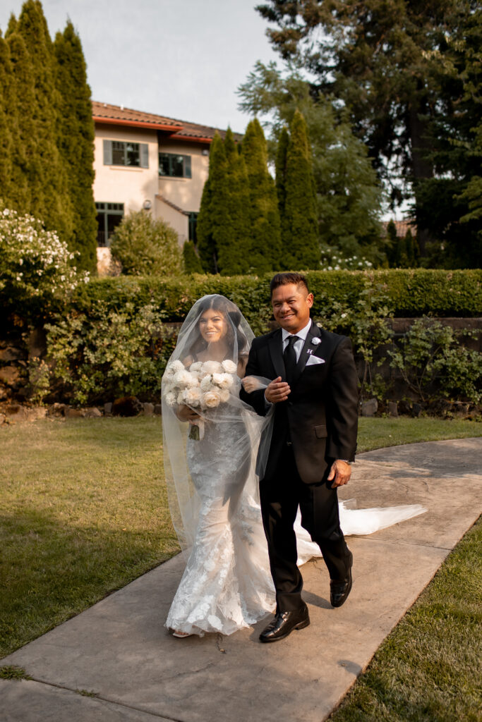 bride walking down aisle with dad at oregon wedding