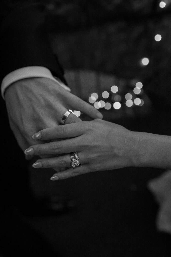 pacific northwest wedding photographer takes photos of bride and grooms rings