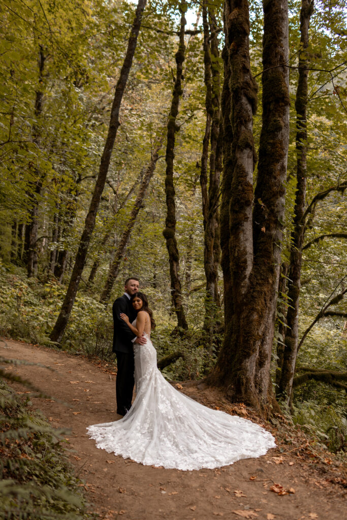 bride and groom in hood forest oregon trees