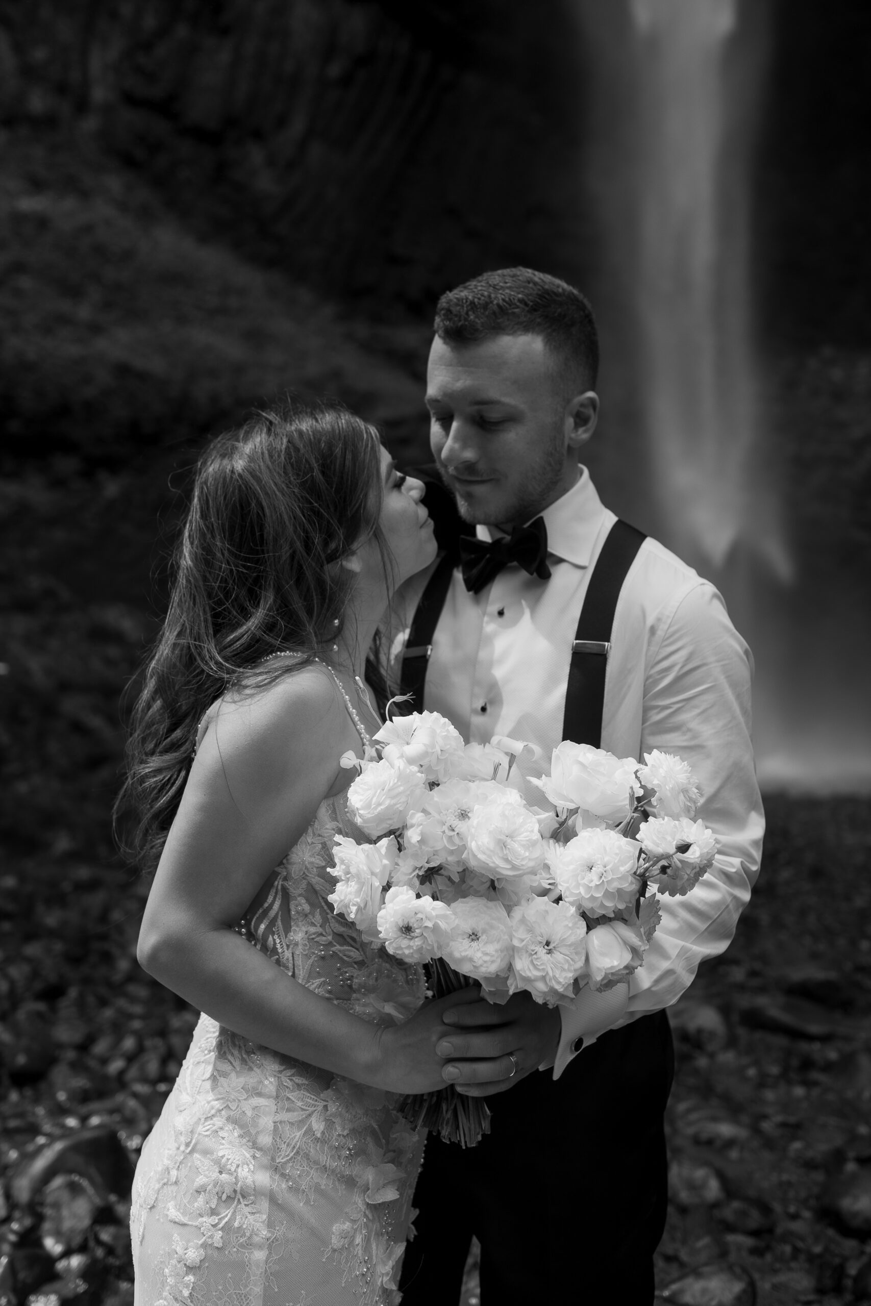 wedding photography in the pacific northwest of couple at waterfall