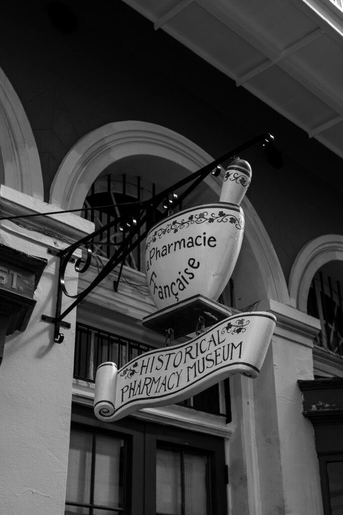 Historical Pharmacy Museum in New Orleans, LA. Black and white photo to show the historical emblem.