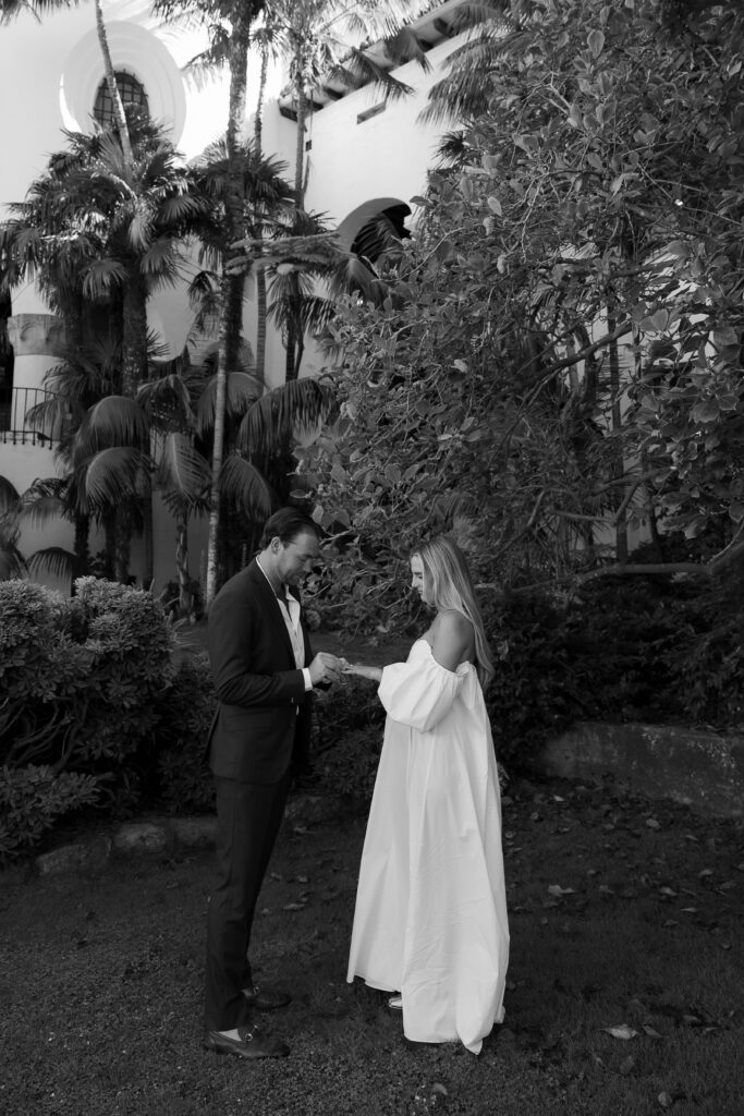 couple reading vows to eachother at the santa barbara courthours for their elopement in california