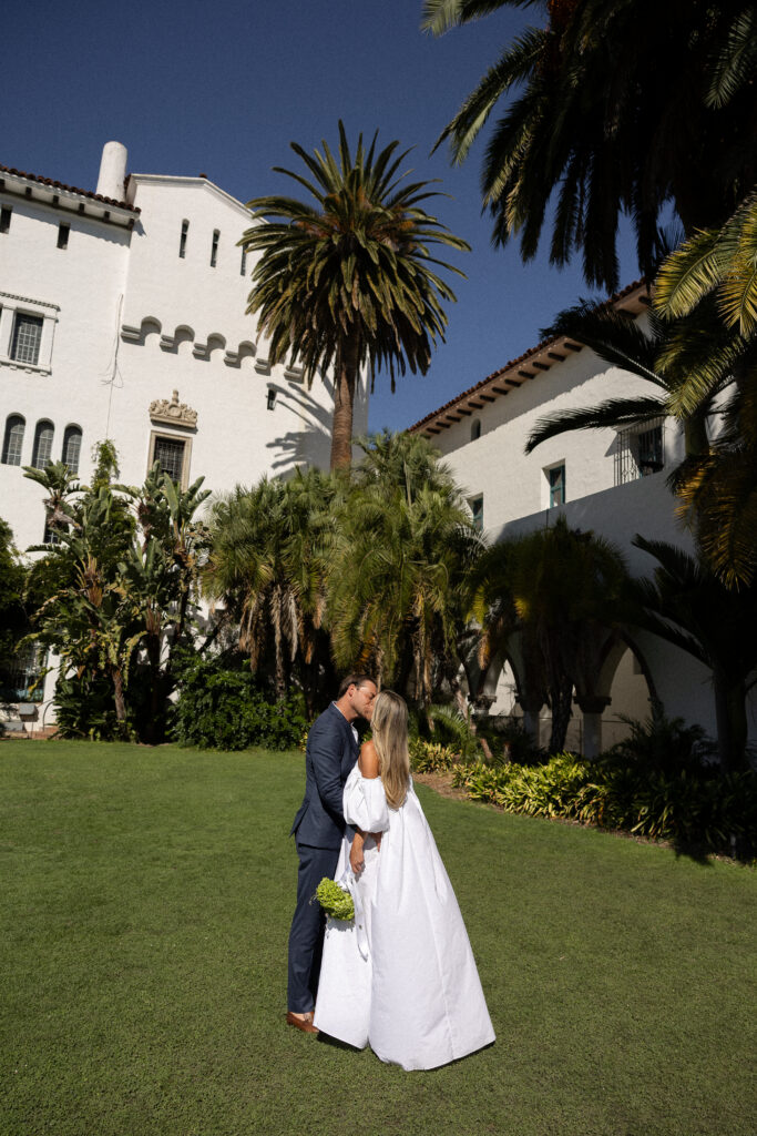 couple kiss at santa barbara courthouse elopement