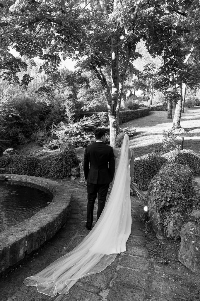 bride and groom walking away just married