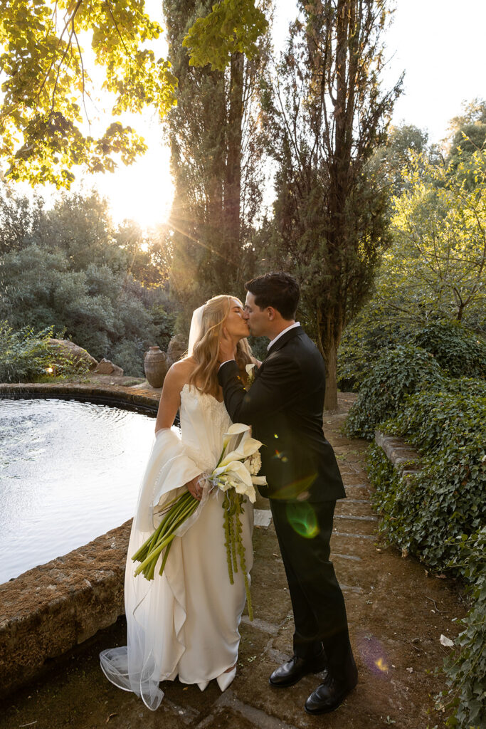 bride and groom share a kiss after their wedding in italy