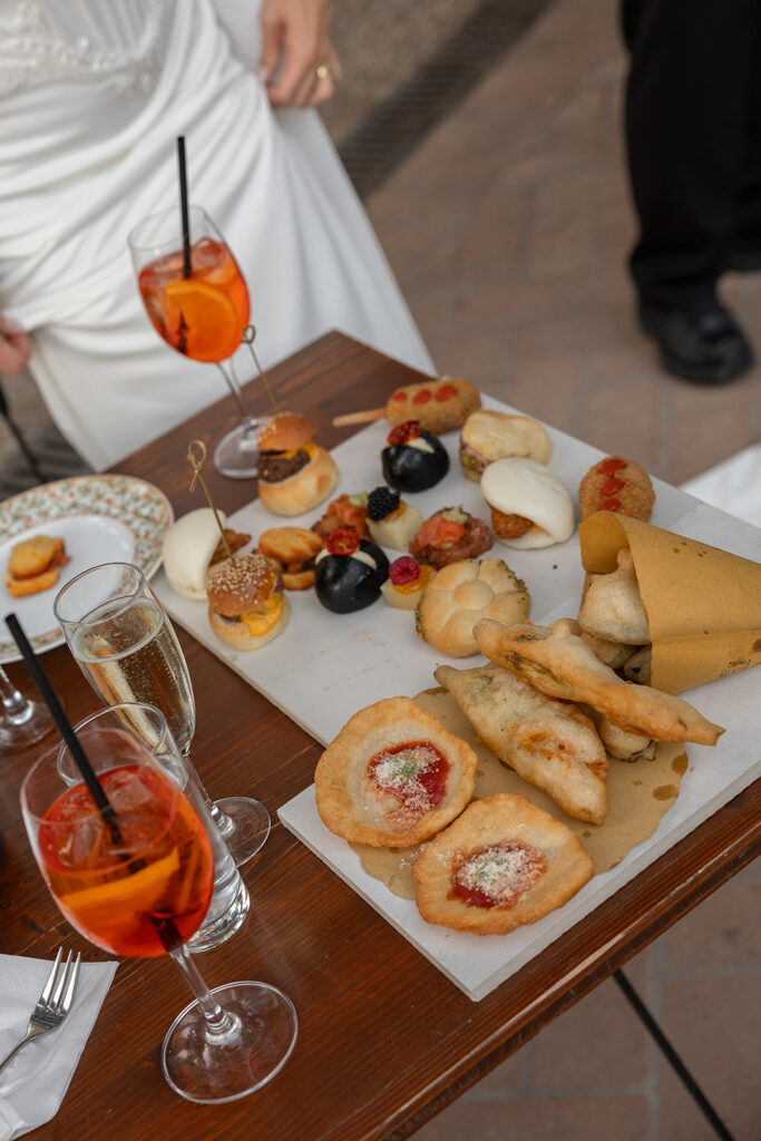 italian foods and aperol spritz during cocktail hour after wedding